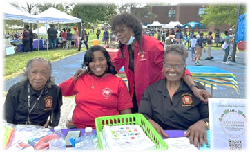 Benice Hall,(Dawn Brice from the Judy Center) Dora Smith & Cynthia Davis at Moravia Park Elementary School’s Spring Festival Bernice Hall and Cynthia Davis worked at the Information Booth handing out fruit to the children and information to the parents. Dora Smith assisted the 
children with games and handed out snowballs.